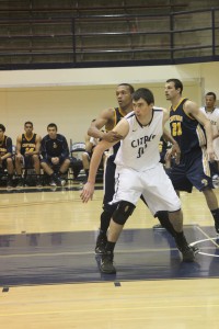 Sophomore center Brent Watkins fights for post position in a Feb. 6 game against the College of the Canyons. 