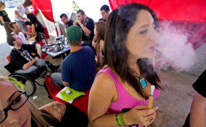 Renee Dotson exhales marijuana smoke while taking a break in the smoking room during the 2nd Annual Kush Expo at the Anaheim Convention Center in California July 10, 2011. Thousands of marijuana patients and patrons gathered over the weekend for a three-day celebration of all things cannabis. Organizers of the Kush Expo named the event after a slang term for high-grade marijuana. (Michael Goulding/Orange County Register/MCT)