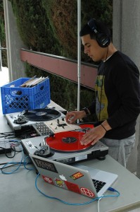 21-year-old Ghandy Soria, a.k.a. DJ Ghandy, spins the ones and twos during Springfest 2013 in the campus mall. (Cole Petersen / Citrus College Clarion)