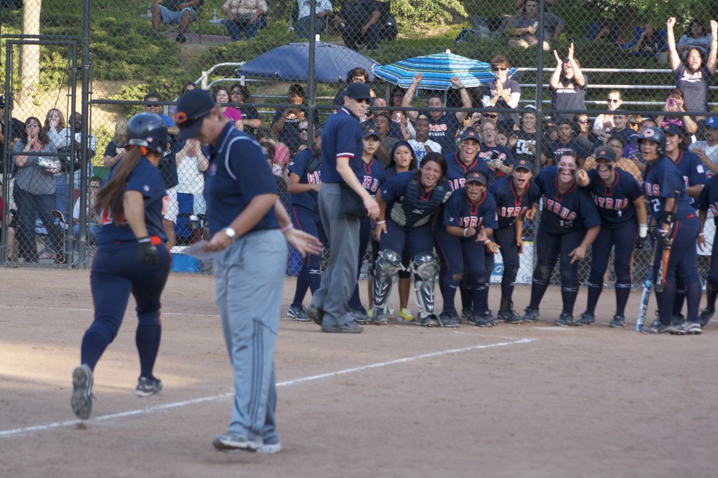 Owls gather at the plate to welcome Bre Lockett (#16) after her home run against RCC at the Super Regionals May 10. (Javier Galaviz / Citrus College Clarion)