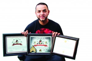 Julian Espejo pictured above with his awards he received while serving in the U.S. Army. (Jessica Soto/Citrus College Clarion)