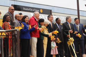 The Metro Board of Directors and Los Angeles Mayor Eric Garcetti (center) cut a gold ribbon to being rides to the six new Gold Line extensions. Photo: Megan Bender (Clarion)
