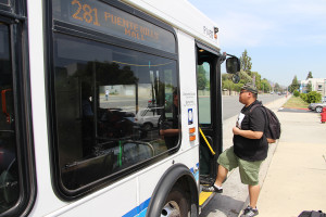 Studio arts major Ernest Santos steps onto the 281 Foothill Transit bus to go home to San Dimas after school. The 281 is one of several bus lines that service Citrus College that more students will have access to once the Class Pass program is implemented this fall. (Darius Johari/Clarion)