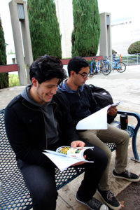 Sahara Barba Clarion Nestor Aquino, physics major, and Angel Macias, biological science major, look through the first volume of Alis, the Citrus College student academic journal. The two students are working together to produce the second volume.