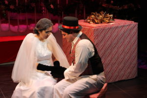 Sarah Snowflake, played by Evelyn Urias, and Sigmund Snowflake, played by Ryan Lyle, act in a scene from "The Christmas Box" on Nov. 28 inside the Little Theatre. Photo by John Michaelides.