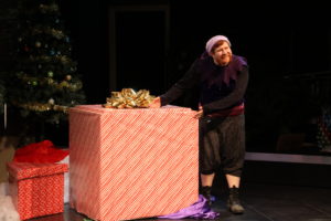 Evil Fred, played by Gabriel Olague, in a scene from "The Christmas Box" on Nov. 28 in the Little Theatre. Photo by John Michaelides.