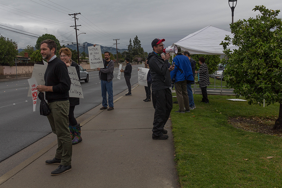 Professors march rain or shine