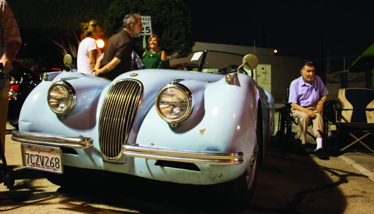 Warren and Lauren Tapia park their bluish Jaguar at the front of the Glendora Flashback Car Show on Aug. 18. The Tapias have had this 1951 Jaguar “20” in their family since the 1960s.