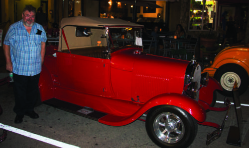 Richard Harrant poses with a restored 1928 Ford Model A on Aug. 18 in Glendora. Harrant was born in a Model A from the same year.